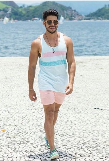 man-in-sleeveless-top-taking-a-walk-by-the-waterside