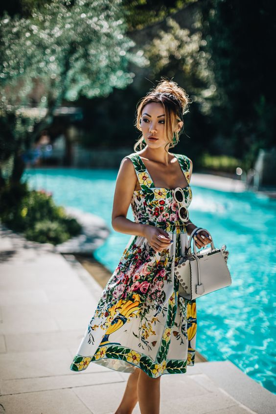 model wearing a dress pool side