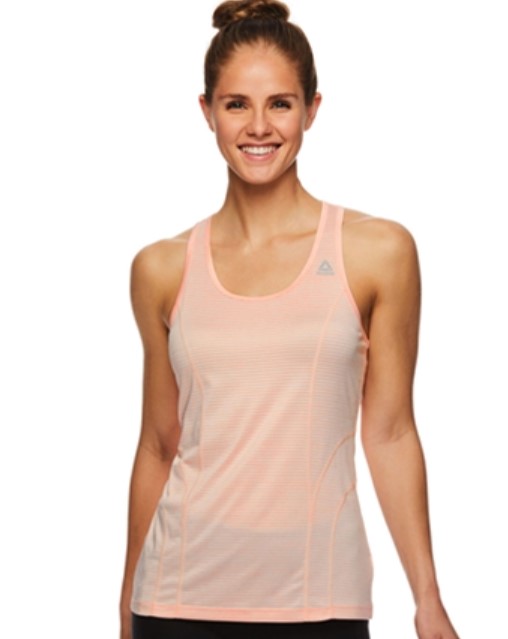 women smiling and wearing a nude pink racer back top