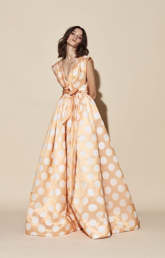 Princess silhouette dress in white and coral polka dot print