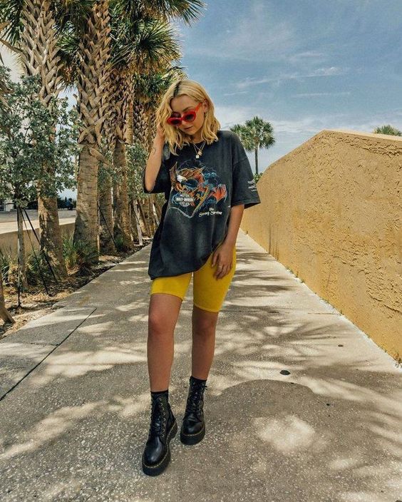 lady combines graphic tee with Biker Shorts