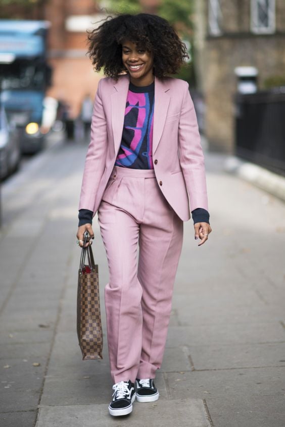 lady combines graphic tee with a power suit