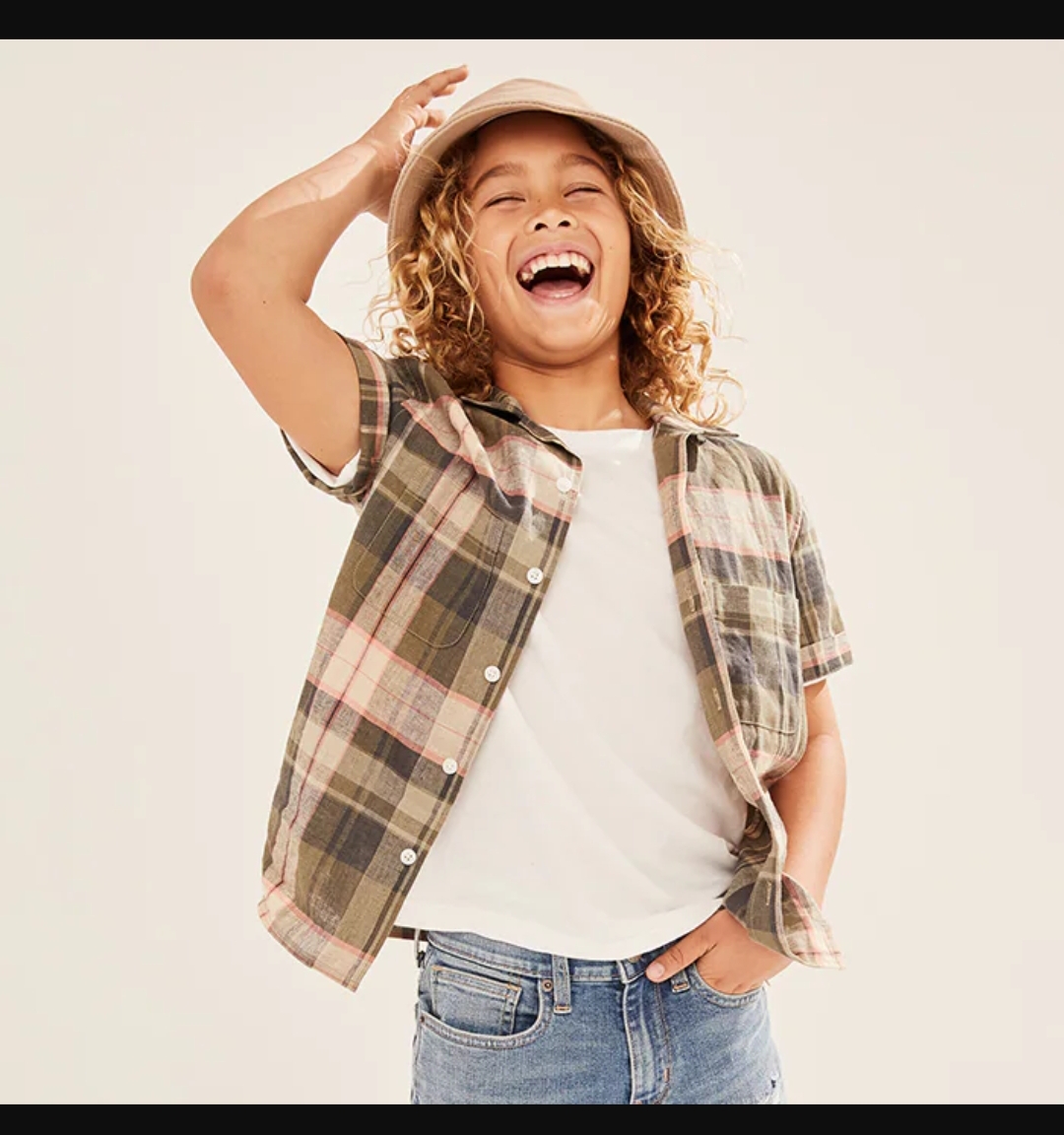 boy models an Old Navy button down shirt