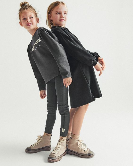 girl on left models in zara sports suit