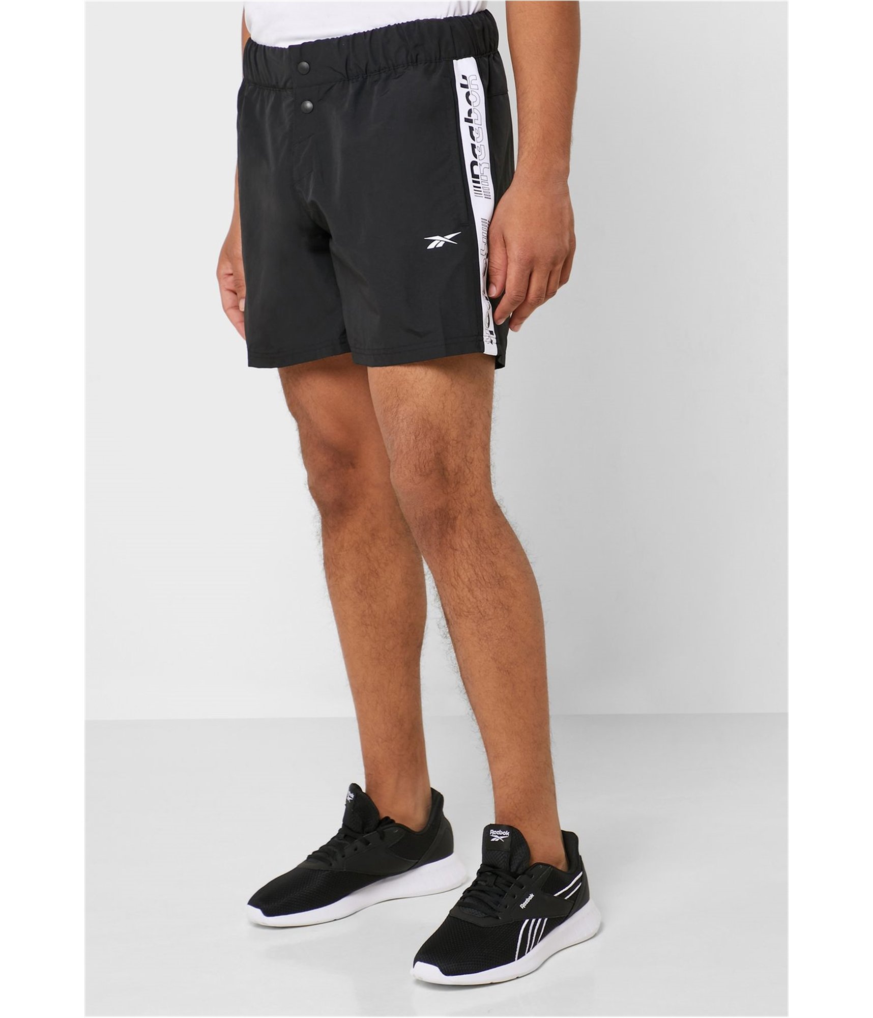 Man-wearing-button-fly-comfort-gym-shorts