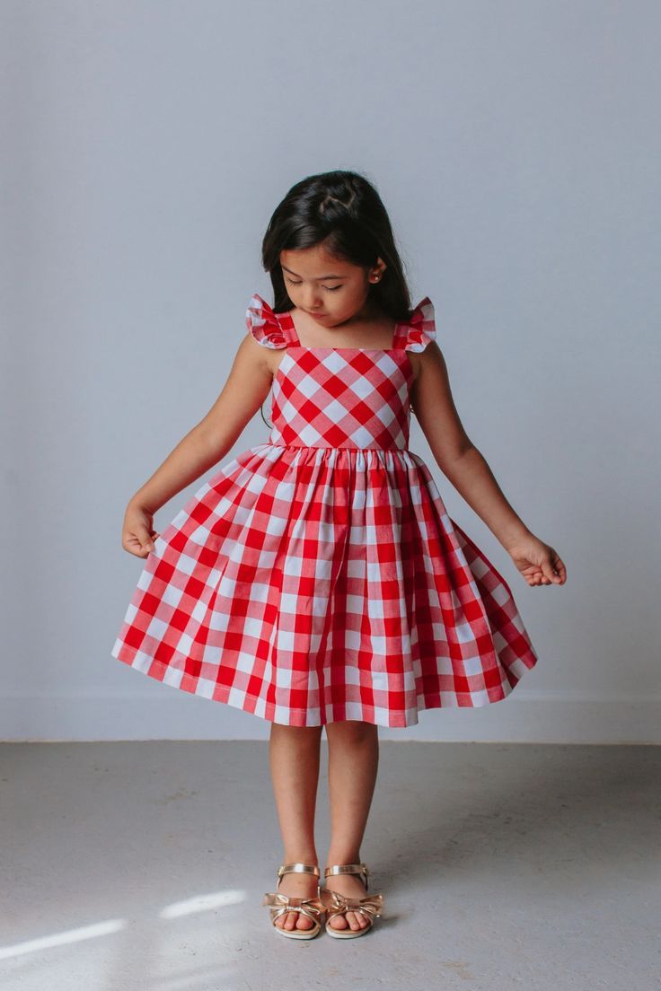 Little girl in cotton plaid dress