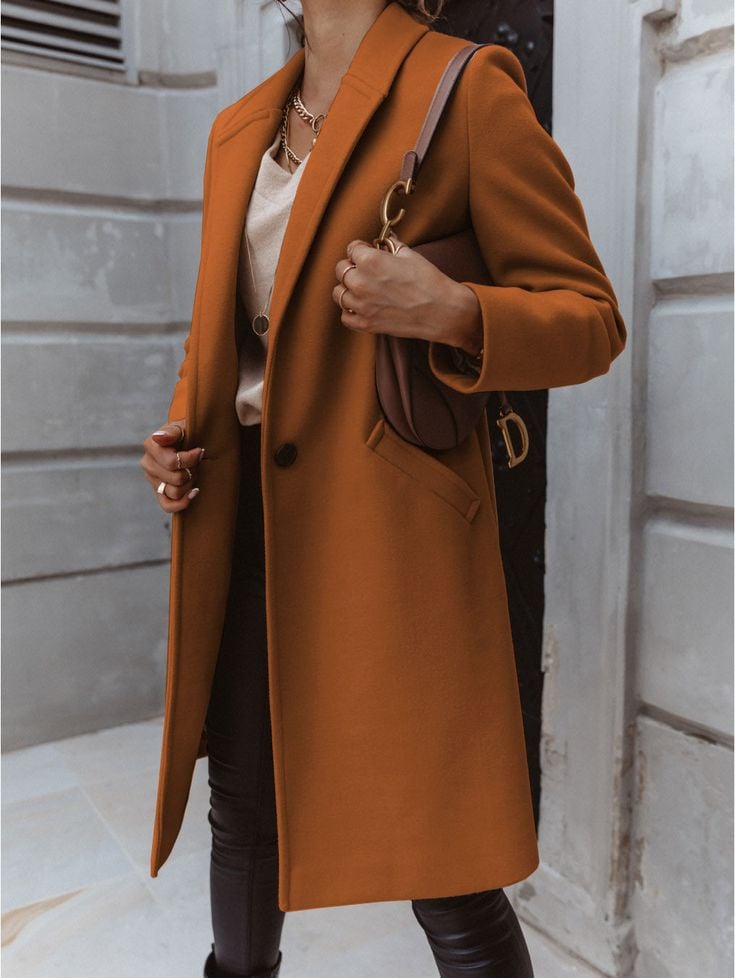 A woman pairing a pant with a coat