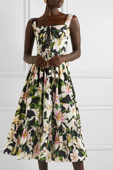 lady models in sleeveless floral dress