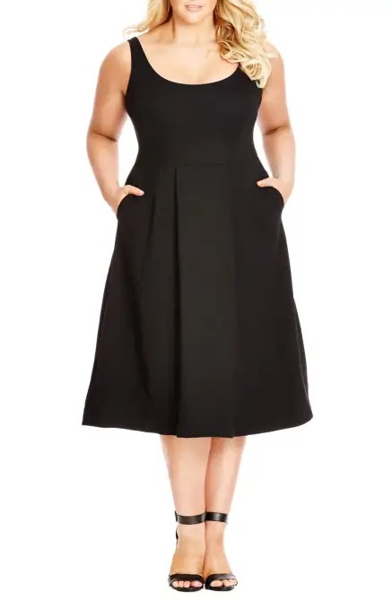 lady in black flared skirt midi dress